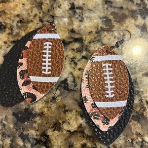 Dangle football earrings with leopard print backing